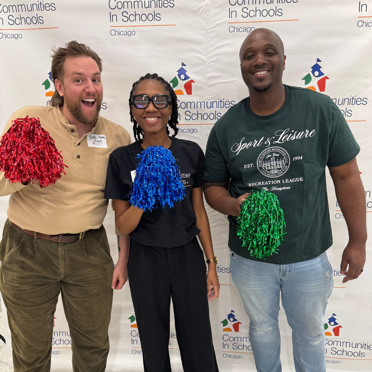 CIS staff at Resource Fair with banner in background