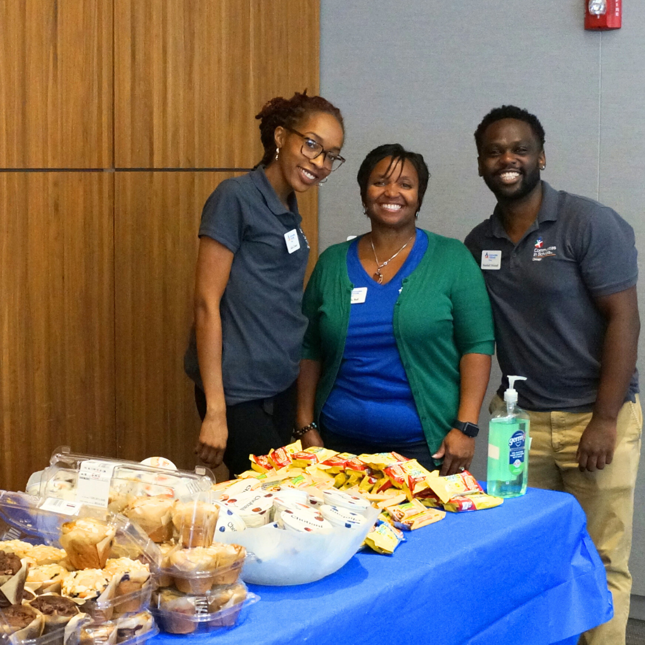 CIS staff at Resource Fair, food table in foreground