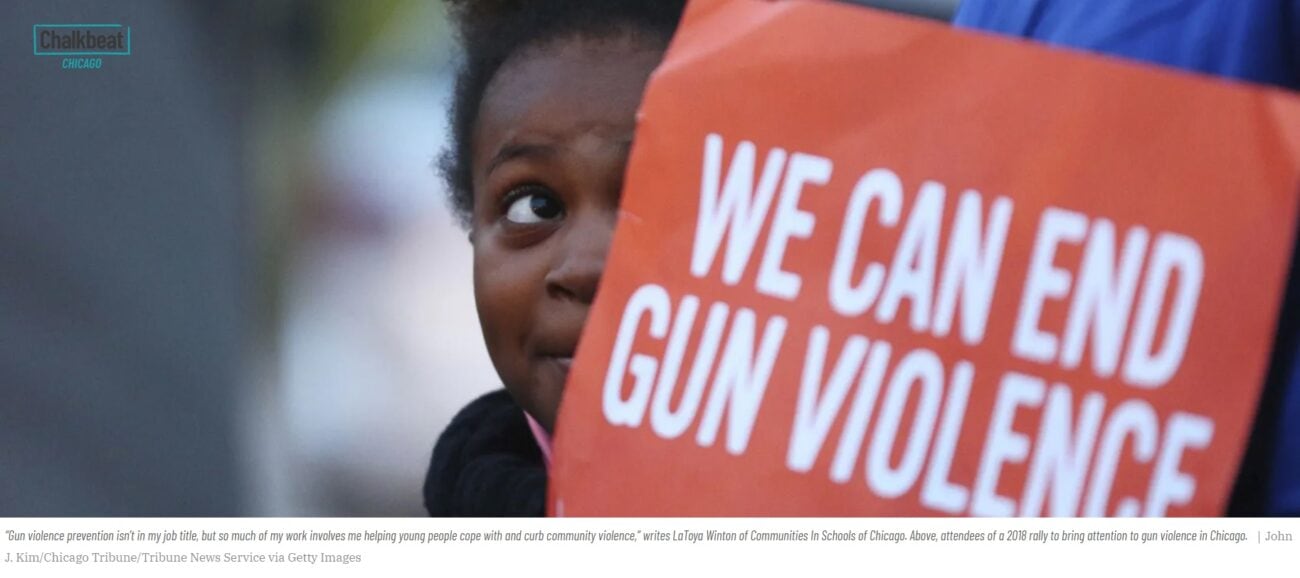 Young person holds sign that reads "We can end gun violence."