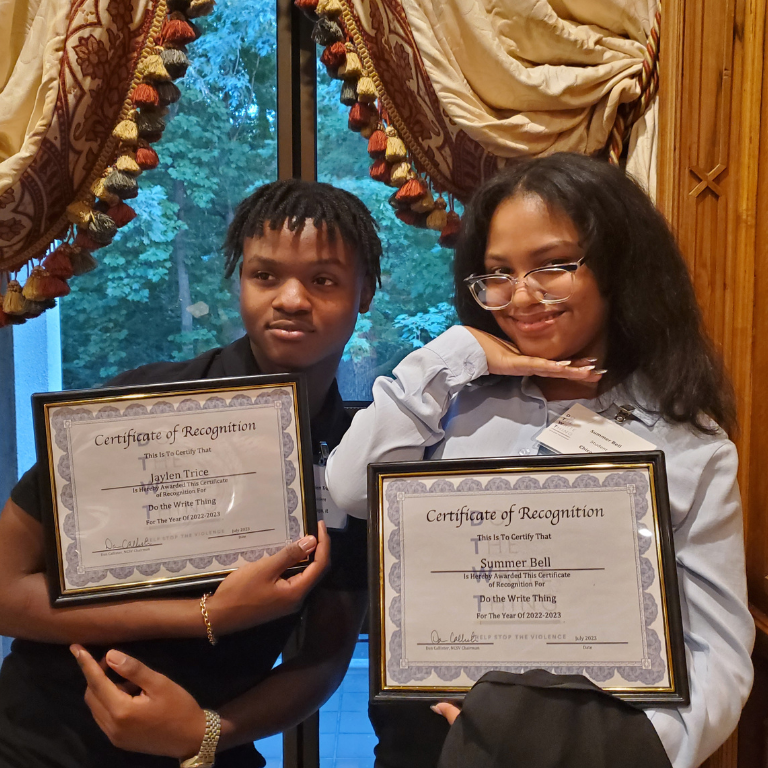 Students pose with certificates