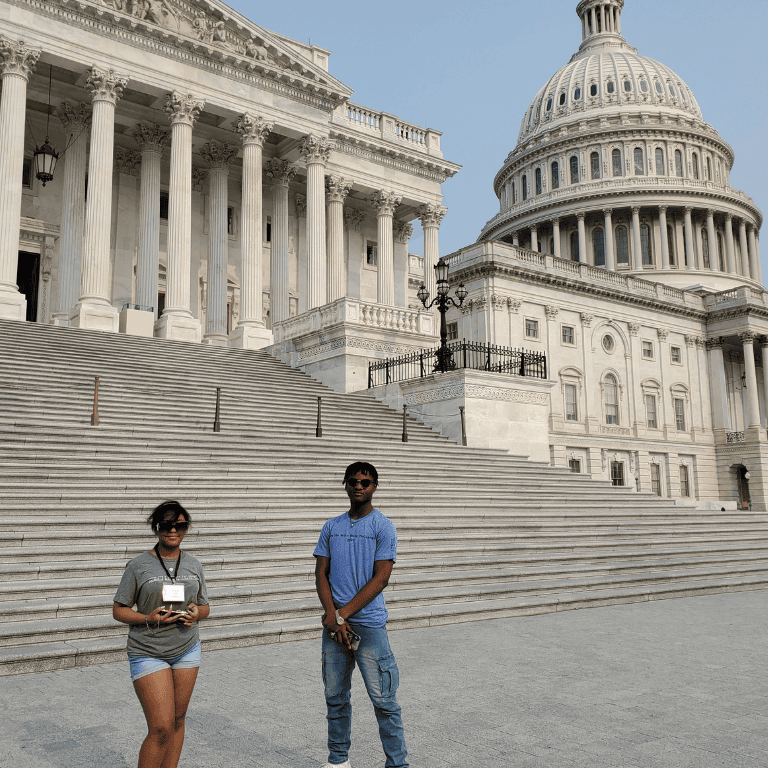 Students stand outside of capitol