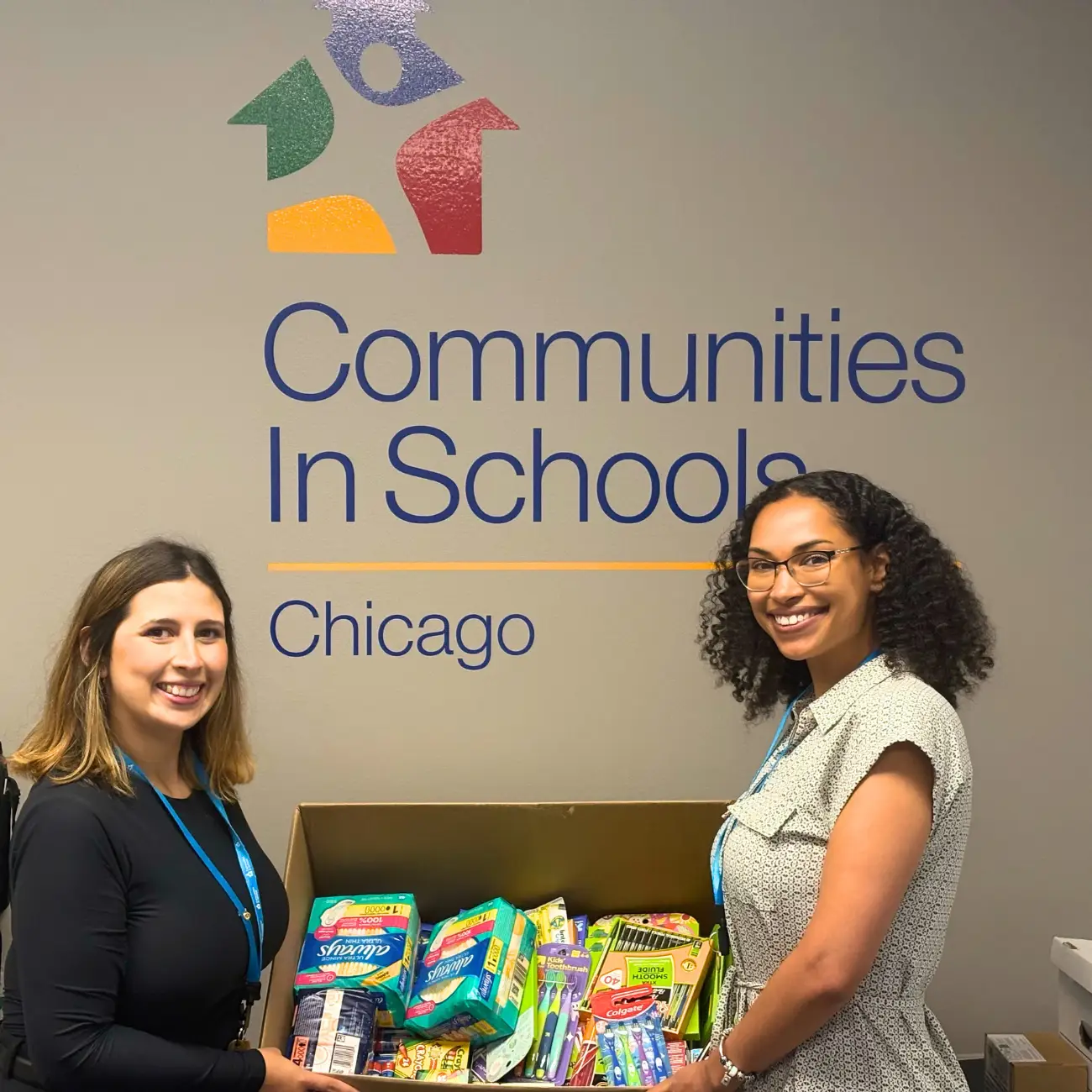 Dev Team poses with school supplies