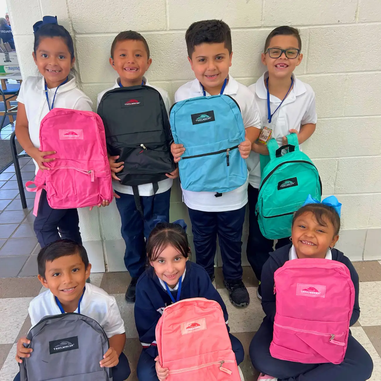 Students holding backpacks
