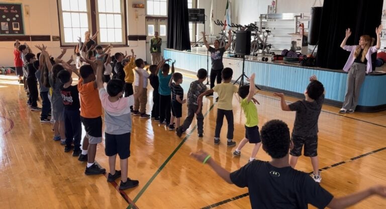 Students learn Latin dance from CIS community partner